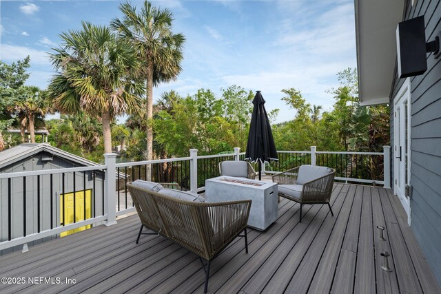2740 Loja St, Saint Augustine, FL 32084 - wooden terrace featuring an outdoor fire pit