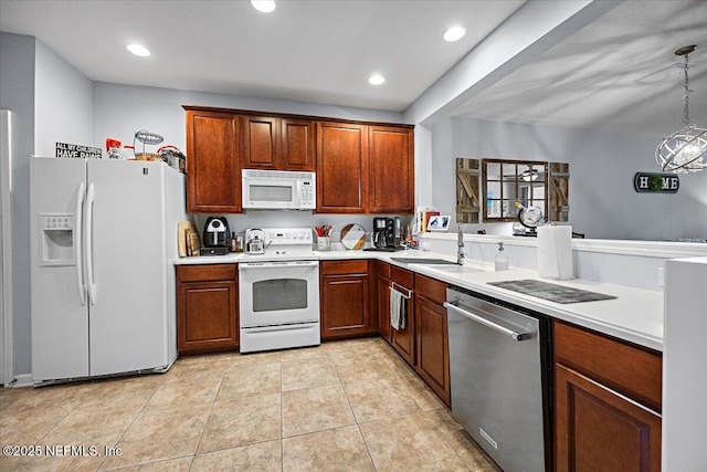 13529 Stone Pond Dr, Jacksonville, FL 32224 - kitchen featuring white appliances, light countertops, a sink, light tile patterned floors, and recessed lighting