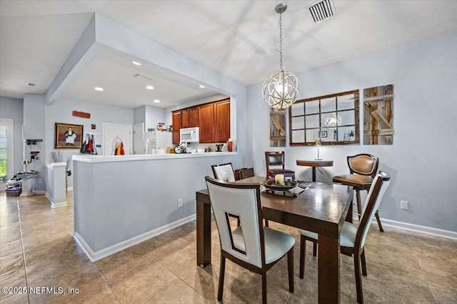 13529 Stone Pond Dr, Jacksonville, FL 32224 - dining room with a chandelier, recessed lighting, light tile patterned floors, and baseboards