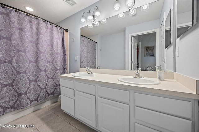13529 Stone Pond Dr, Jacksonville, FL 32224 - full bathroom featuring tile patterned floors, double vanity, and curtained shower