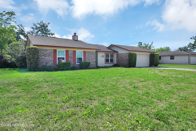 single story home featuring a chimney, an attached garage, driveway, and a front yard