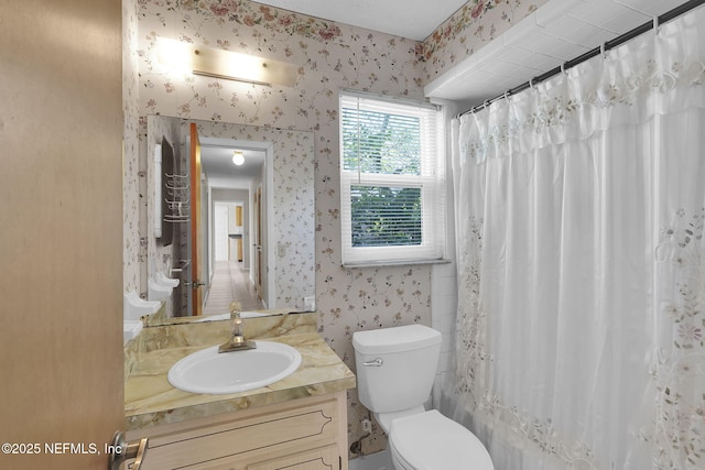 full bathroom featuring shower / bath combo, wallpapered walls, toilet, and vanity