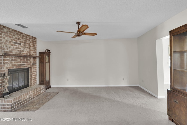 unfurnished living room with visible vents, baseboards, carpet flooring, and ceiling fan