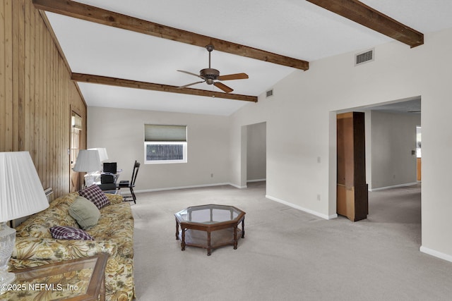 living area with baseboards, a ceiling fan, visible vents, and carpet floors