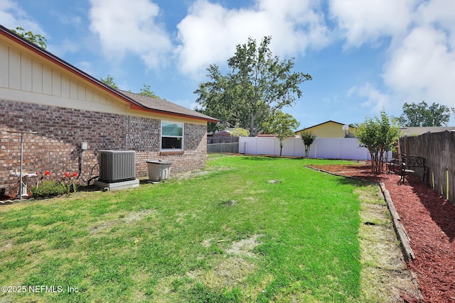 view of yard with a fenced backyard and cooling unit