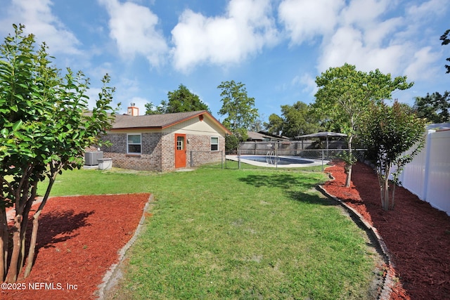 view of yard with a fenced backyard and a fenced in pool