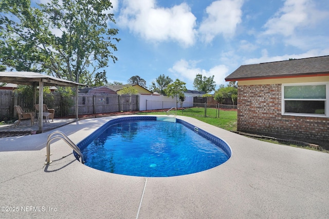 view of swimming pool with a fenced in pool, a fenced backyard, a patio area, a lawn, and a gazebo