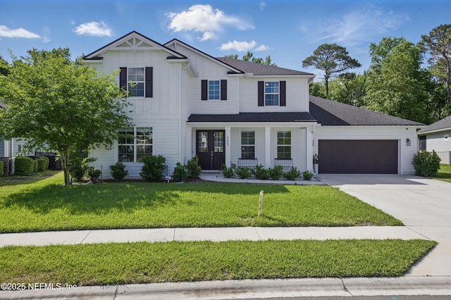 177 Windwalker Dr, Saint Augustine, FL 32092 - modern farmhouse style home featuring a garage, driveway, board and batten siding, and a front yard