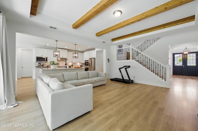 177 Windwalker Dr, Saint Augustine, FL 32092 - living area with stairs, recessed lighting, beam ceiling, and light wood-type flooring