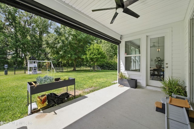 177 Windwalker Dr, Saint Augustine, FL 32092 - view of patio / terrace featuring a ceiling fan, a playground, and view of scattered trees