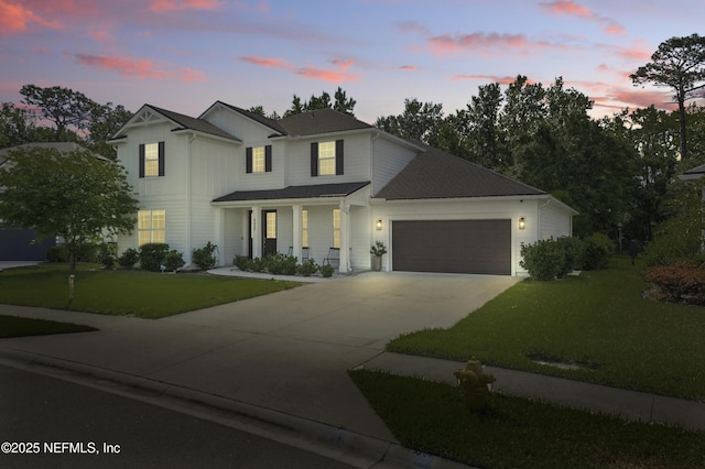 177 Windwalker Dr, Saint Augustine, FL 32092 - view of front of house with driveway, an attached garage, a front lawn, and covered porch