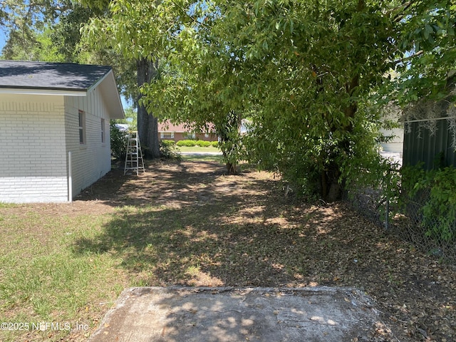 view of yard featuring fence