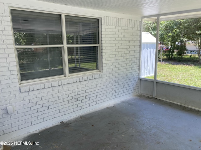 unfurnished sunroom with a wealth of natural light