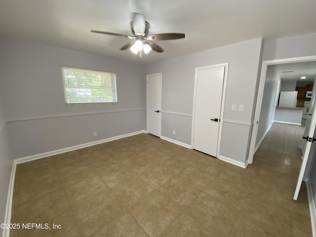2320 Ardmore Ct, Jacksonville, FL 32211 - unfurnished bedroom with baseboards and a ceiling fan
