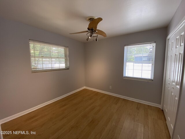 2320 Ardmore Ct, Jacksonville, FL 32211 - empty room featuring wood finished floors, a ceiling fan, and baseboards