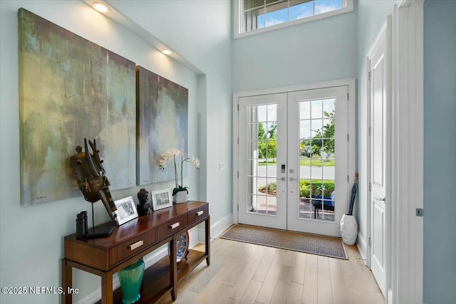 36 Preserve Island Cir, Ponte Vedra Beach, FL 32082 - entryway featuring a towering ceiling, wood finished floors, french doors, and baseboards