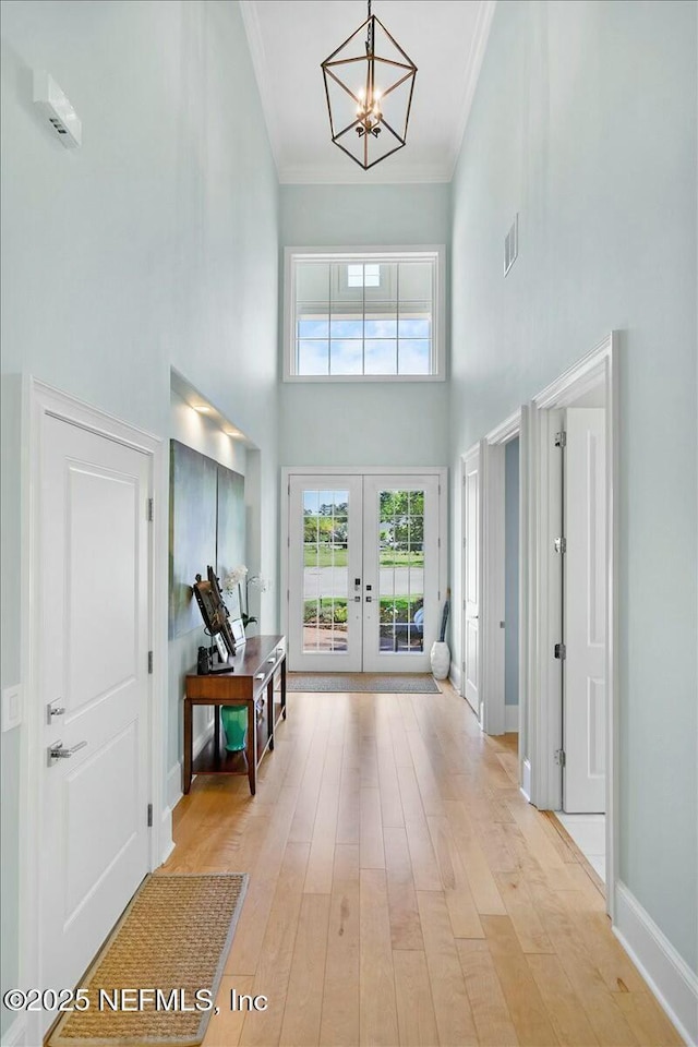 36 Preserve Island Cir, Ponte Vedra Beach, FL 32082 - foyer featuring visible vents, a notable chandelier, french doors, crown molding, and a towering ceiling