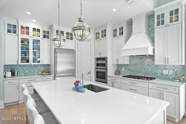 36 Preserve Island Cir, Ponte Vedra Beach, FL 32082 - kitchen featuring decorative backsplash, custom range hood, appliances with stainless steel finishes, a sink, and visible vents
