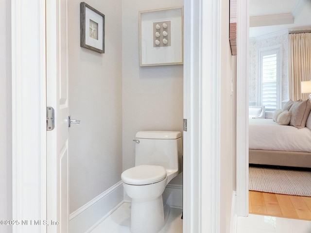 36 Preserve Island Cir, Ponte Vedra Beach, FL 32082 - bathroom with baseboards, ornamental molding, toilet, and ensuite bathroom