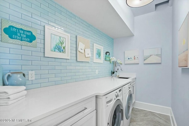 36 Preserve Island Cir, Ponte Vedra Beach, FL 32082 - washroom featuring washing machine and dryer, baseboards, cabinet space, and a sink