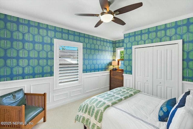 36 Preserve Island Cir, Ponte Vedra Beach, FL 32082 - carpeted bedroom with wallpapered walls, a closet, ceiling fan, a wainscoted wall, and crown molding