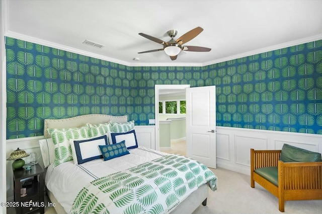36 Preserve Island Cir, Ponte Vedra Beach, FL 32082 - bedroom featuring a wainscoted wall, carpet flooring, visible vents, a ceiling fan, and crown molding