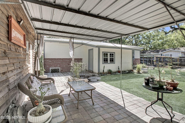 view of patio / terrace featuring fence