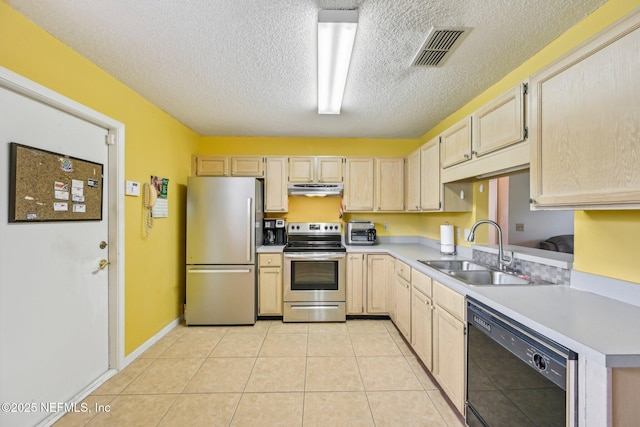 kitchen featuring a sink, under cabinet range hood, light brown cabinets, visible vents, and appliances with stainless steel finishes