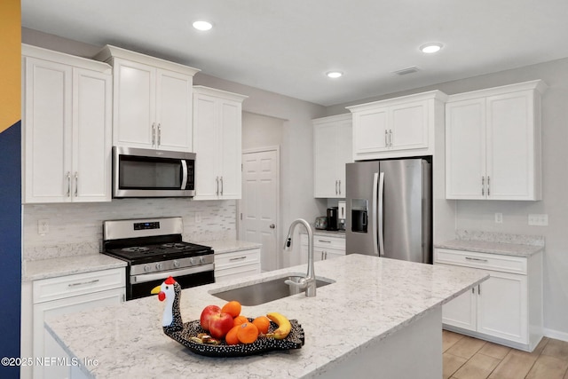 383 Narrowleaf Dr, Saint Johns, FL 32259 - kitchen with white cabinetry, stainless steel appliances, and a sink
