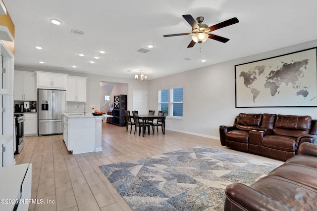 383 Narrowleaf Dr, Saint Johns, FL 32259 - living area featuring ceiling fan with notable chandelier, visible vents, light wood finished floors, and recessed lighting