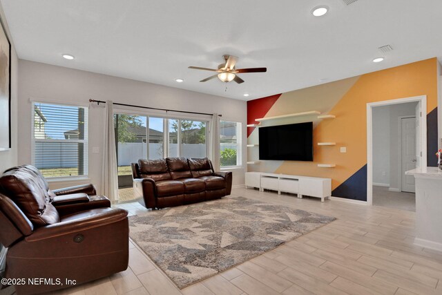 383 Narrowleaf Dr, Saint Johns, FL 32259 - living room with baseboards, a ceiling fan, light wood-style flooring, and plenty of natural light