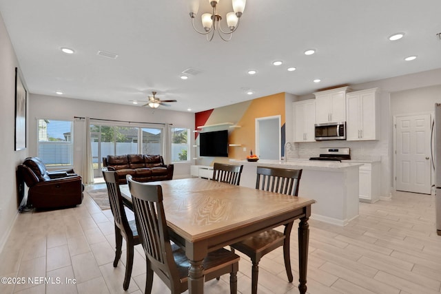 383 Narrowleaf Dr, Saint Johns, FL 32259 - dining space featuring ceiling fan with notable chandelier, light wood-type flooring, baseboards, visible vents, and recessed lighting