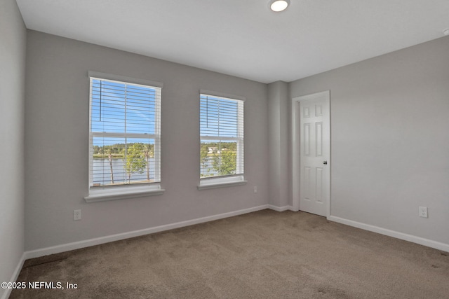 383 Narrowleaf Dr, Saint Johns, FL 32259 - spare room featuring baseboards and carpet flooring