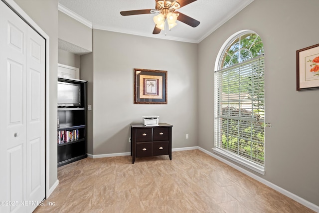 bedroom featuring crown molding, a ceiling fan, and a closet