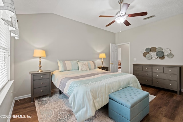 bedroom with visible vents, ceiling fan, baseboards, vaulted ceiling, and wood finished floors