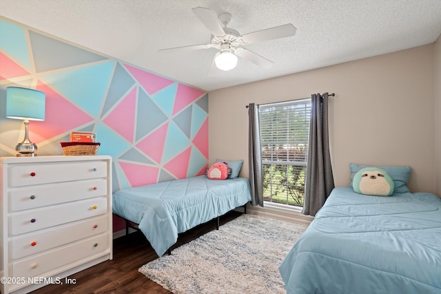bedroom featuring wood finished floors, ceiling fan, and a textured ceiling