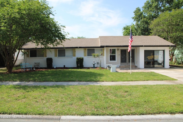 ranch-style home with a front yard