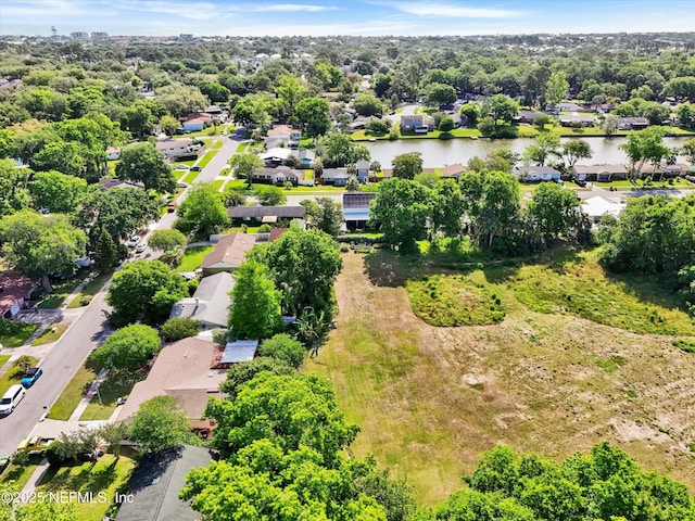 birds eye view of property featuring a residential view and a water view
