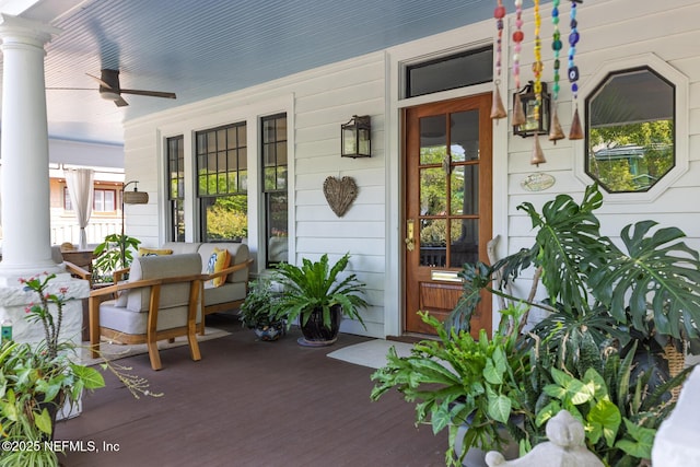 property entrance with a porch and ceiling fan