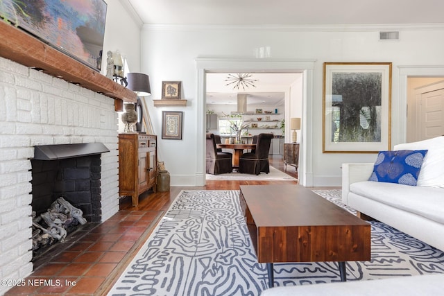 living area featuring crown molding, baseboards, a fireplace, and visible vents