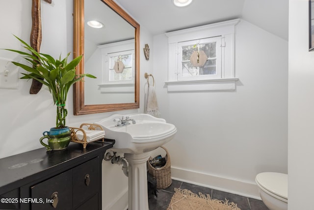 bathroom with recessed lighting, baseboards, tile patterned floors, and toilet