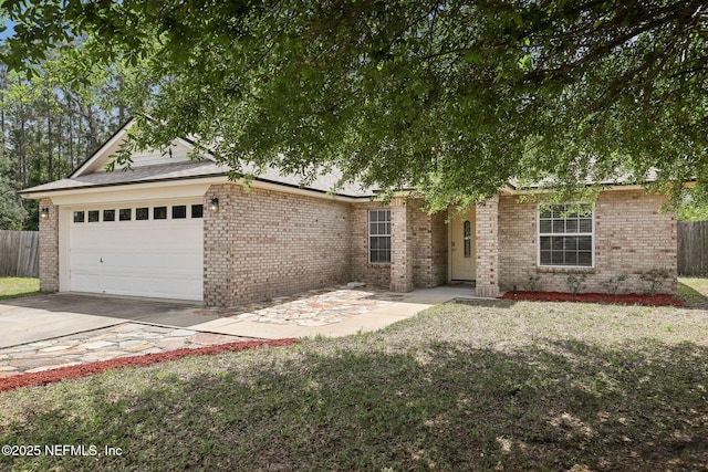 11009 Fawnwood Ct, Bryceville, FL 32009 - ranch-style house featuring fence, concrete driveway, brick siding, and an attached garage