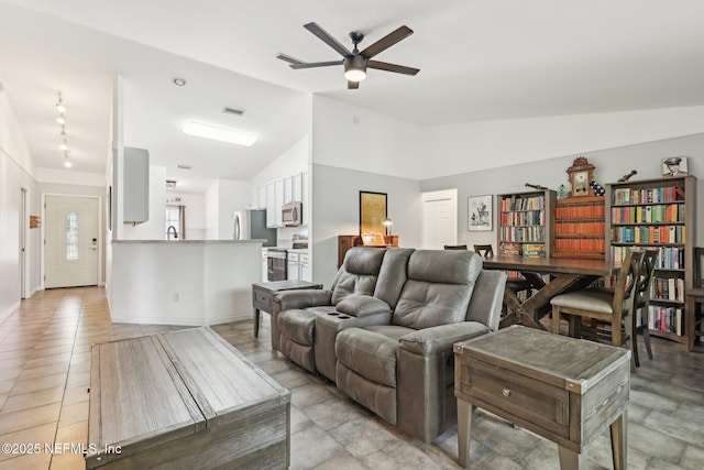 11009 Fawnwood Ct, Bryceville, FL 32009 - living room featuring a ceiling fan, visible vents, and vaulted ceiling