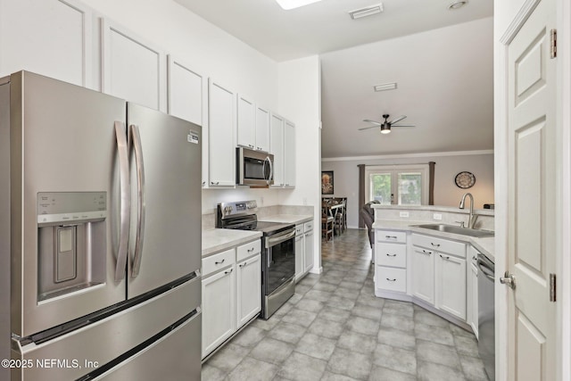 11009 Fawnwood Ct, Bryceville, FL 32009 - kitchen featuring appliances with stainless steel finishes, a sink, visible vents, a ceiling fan, and crown molding