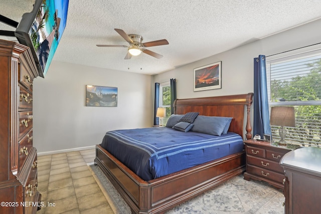 11009 Fawnwood Ct, Bryceville, FL 32009 - bedroom with a textured ceiling, ceiling fan, and baseboards