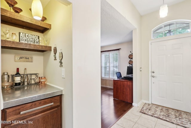 716 Hazelmoor Ln, Ponte Vedra, FL 32081 - foyer entrance with baseboards, a bar, and wood finished floors