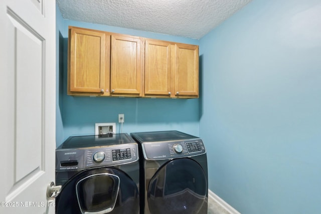 716 Hazelmoor Ln, Ponte Vedra, FL 32081 - laundry room featuring a textured ceiling, cabinet space, and washing machine and clothes dryer
