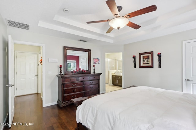 716 Hazelmoor Ln, Ponte Vedra, FL 32081 - bedroom with baseboards, a tray ceiling, wood finished floors, and visible vents