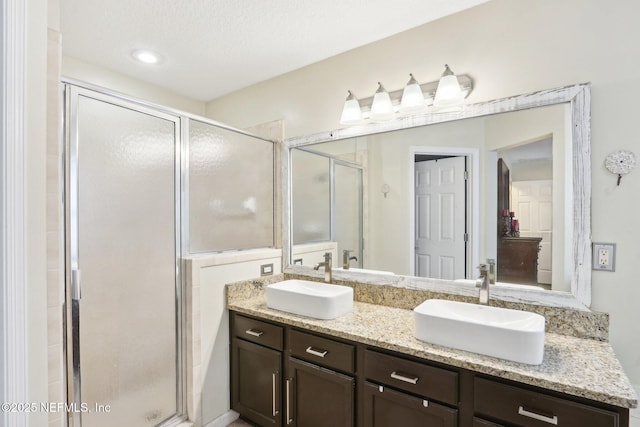 716 Hazelmoor Ln, Ponte Vedra, FL 32081 - bathroom featuring double vanity, a sink, and a stall shower