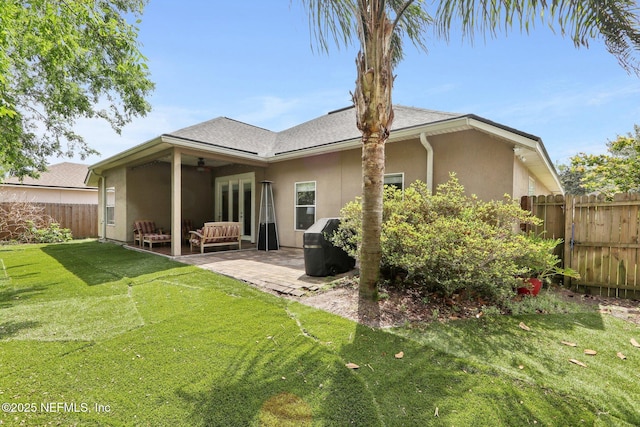 716 Hazelmoor Ln, Ponte Vedra, FL 32081 - rear view of house featuring ceiling fan, a fenced backyard, a yard, a patio, and stucco siding